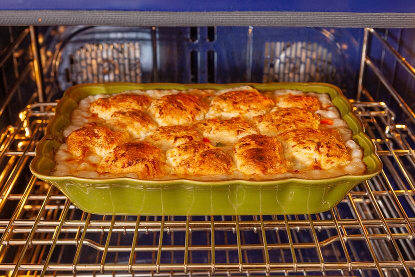 A chicken pot pie browns in the oven.