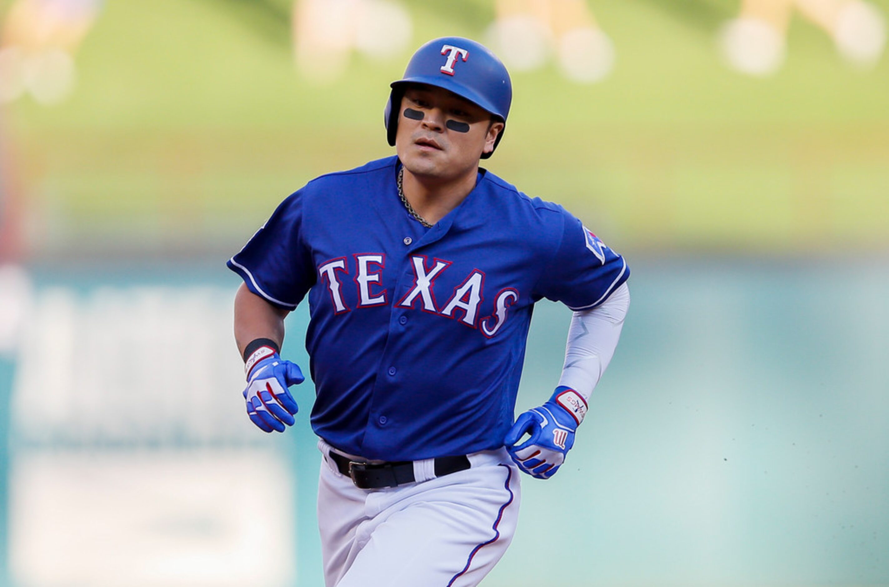 Texas Rangers' Shin-Soo Choo (17) rounds the bases after hitting a solo home run during the...