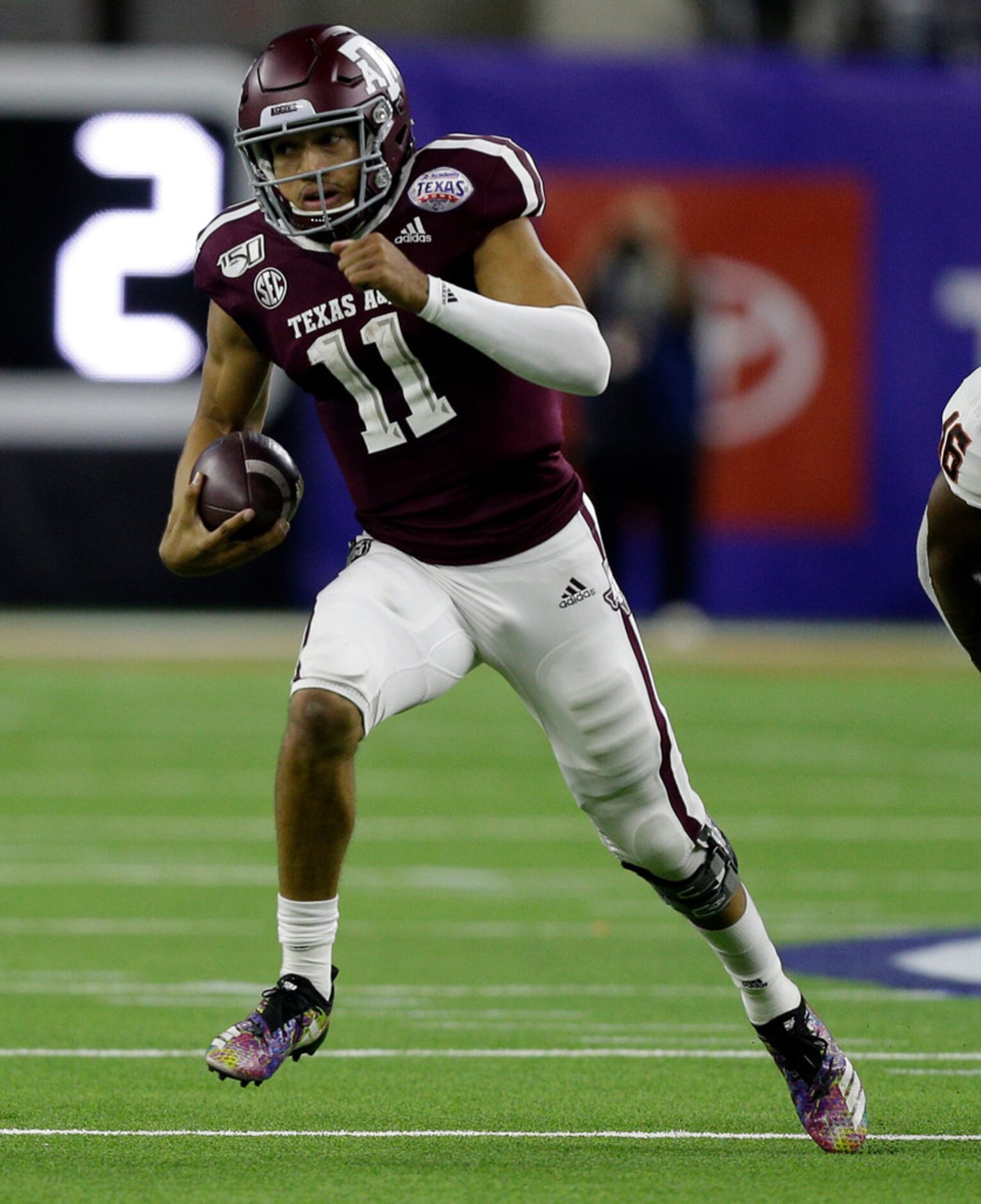 HOUSTON, TEXAS - DECEMBER 27: Kellen Mond #11 of the Texas A&M Aggies runs for 66 yards as...