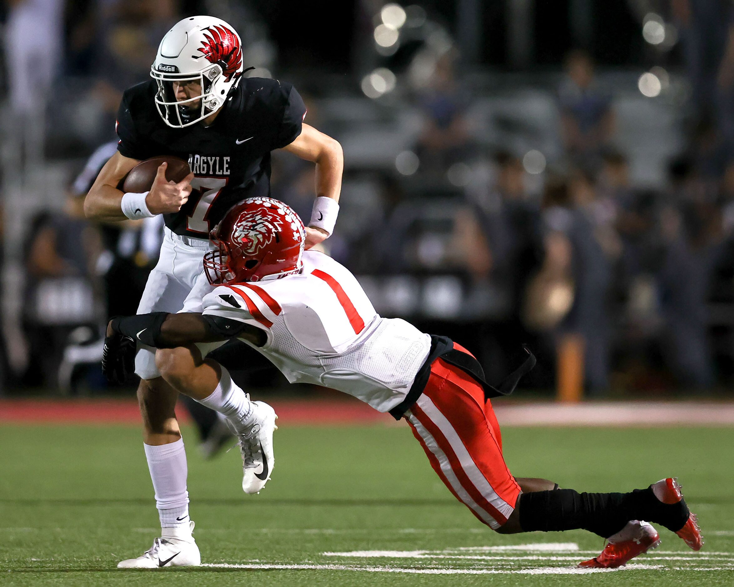 Argyle quarterback Jett Copeland (7) tries to avoid getting tackled by Terrell cornerback...