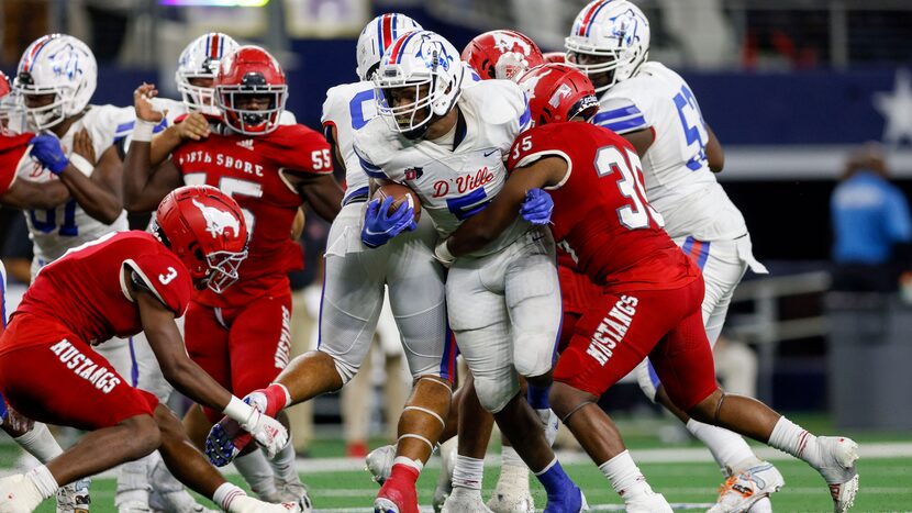 Galena Park North Shore linebacker Josh Garrett (35) tackles Duncanville running back...