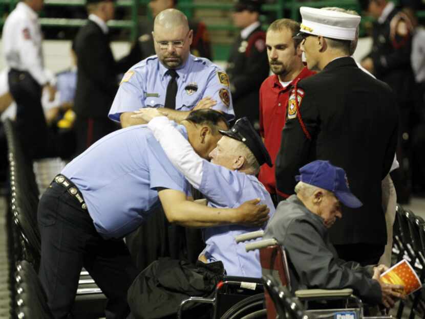 West firefighters consoled one another before Thursday's service, attended by more than...