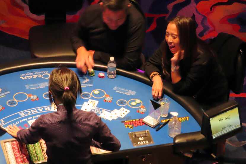 A dealer conducts a card game at the Ocean Casino Resort in Atlantic City, N.J. on Dec. 2,...