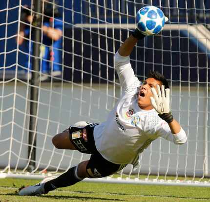 Tigres goalkeeper Alan Flores (331) blocks a shot attempt during shoot out, following double...