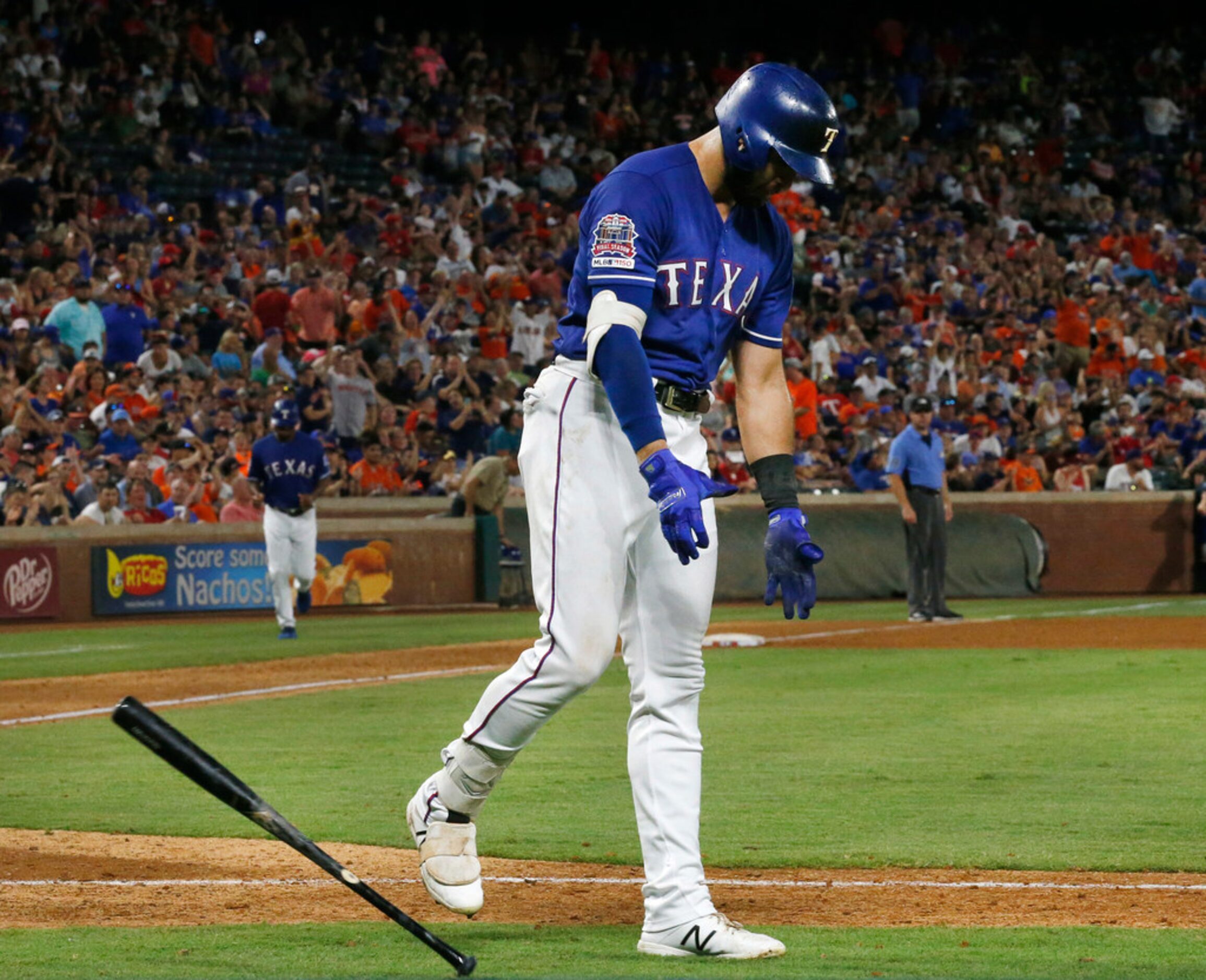 Texas Rangers center fielder Joey Gallo (13) reacts after striking out to end the eighth...