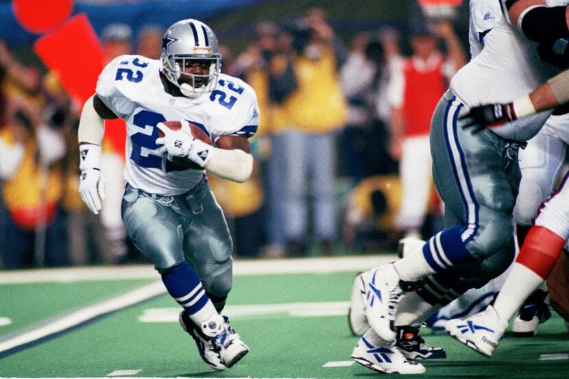 FILE - In this Sunday, Jan. 30, 1994 file photo, Dallas Cowboys running back Emmitt Smith...