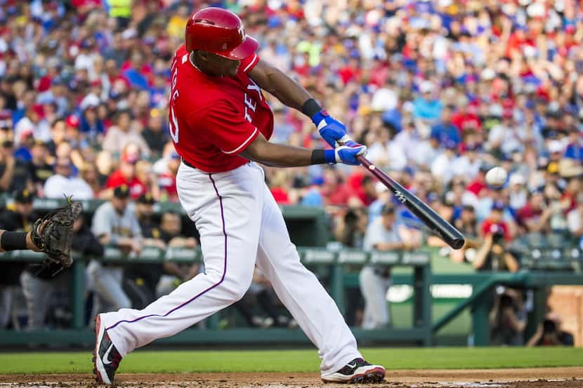 Texas Rangers third baseman Adrian Beltre hits a two-run home run for the 1500th and 1501st...