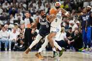 Dallas Mavericks guard Kyrie Irving (11) knocks the ball away from Minnesota Timberwolves...