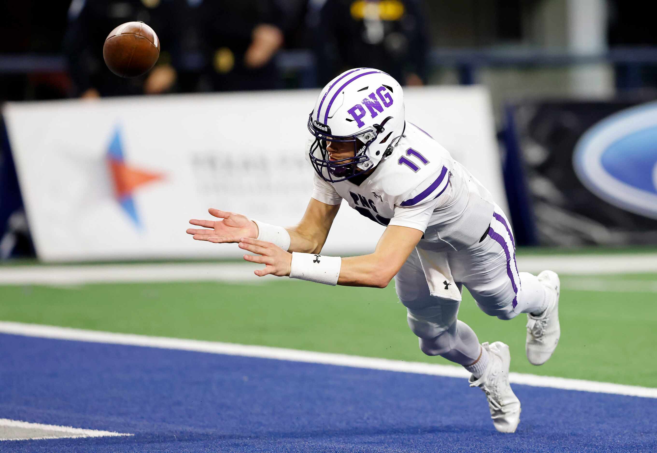 Port Neches-Grove punter/quarterback Cole Crippen (11) throws the ball out of the end zone...