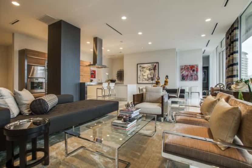 
The living and dining areas of the penthouse residence are unified by contemporary...