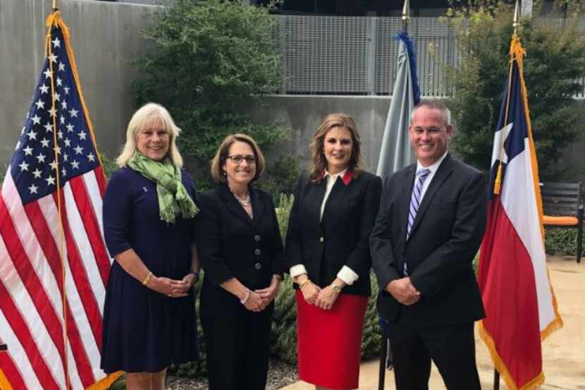 The Family Place in Dallas hosted Tuesday's announcement, attended by (from left) shelter...