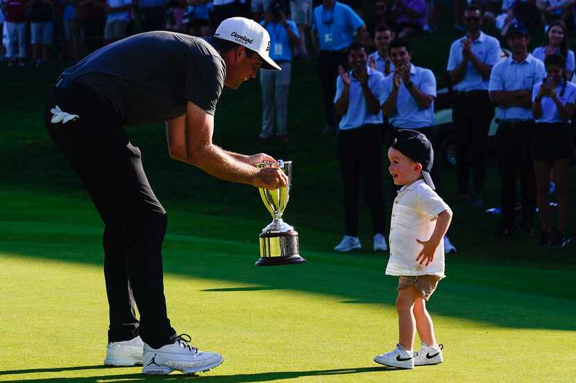 Keegan Bradley celebrates winning the Travelers Championship golf tournament with his son at...