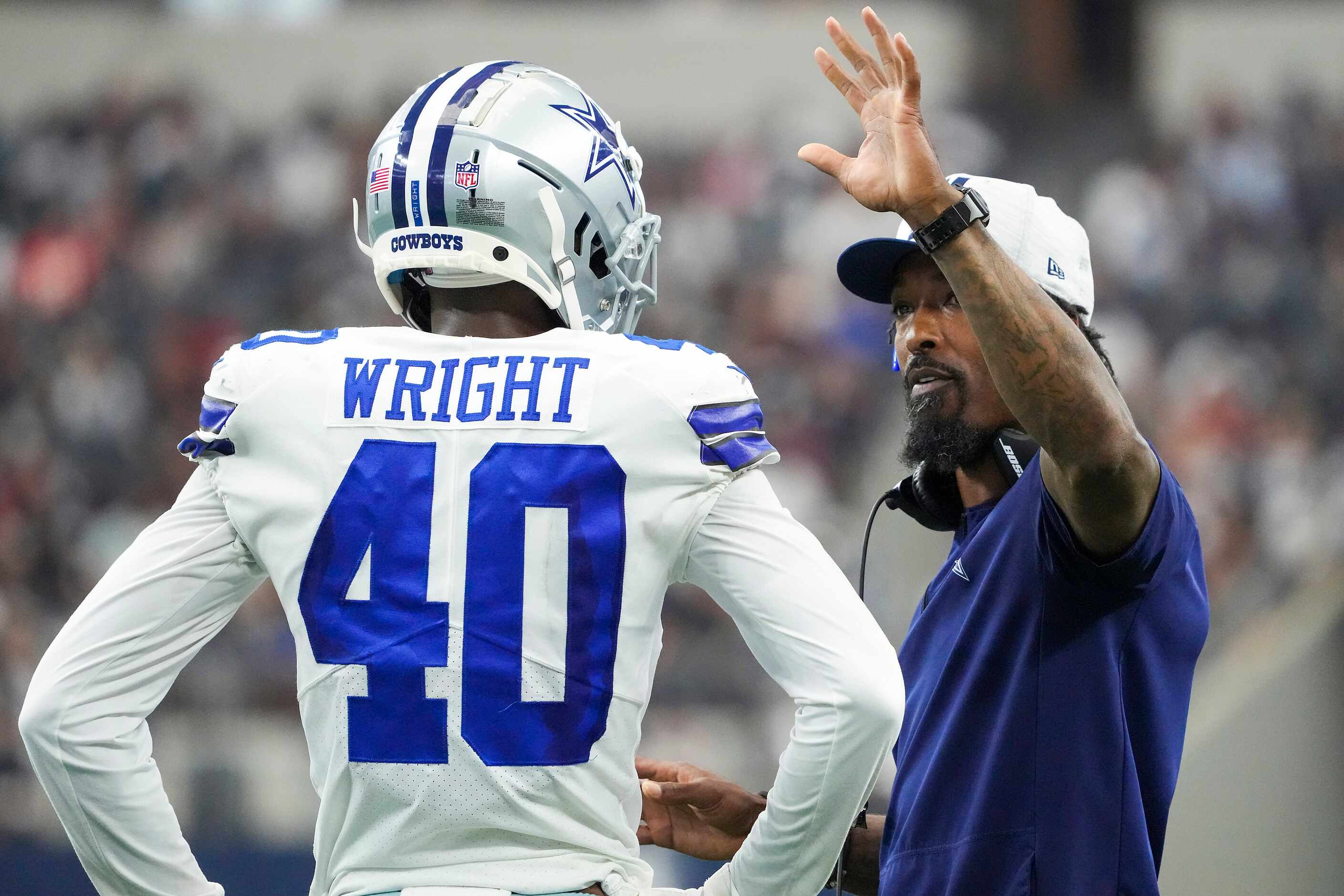 Dallas Cowboys defensive backs coach Al Harris talks with cornerback Nahshon Wright during...