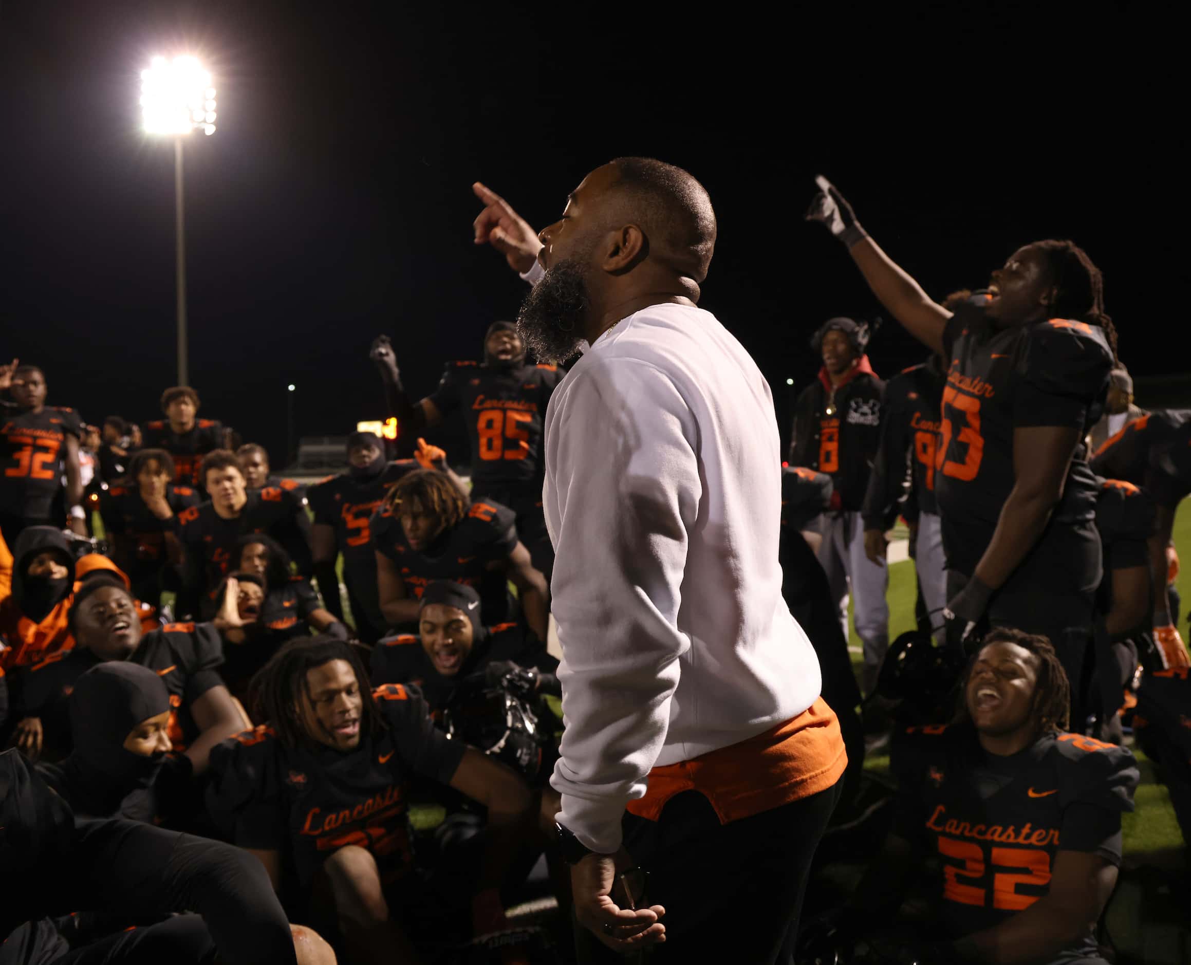 Lancaster head coach Leon Paul, center, speaks to his players following their 27-24...