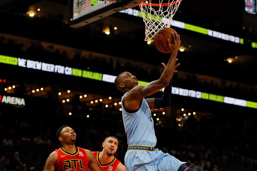ATLANTA, GEORGIA - MARCH 13:  Delon Wright #2 of the Memphis Grizzlies attacks the basket...
