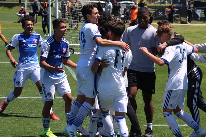 4/14/19 (Frisco, TX): Diego Maynez (11) is mobbed by team mates after scoring FC Dallas'...