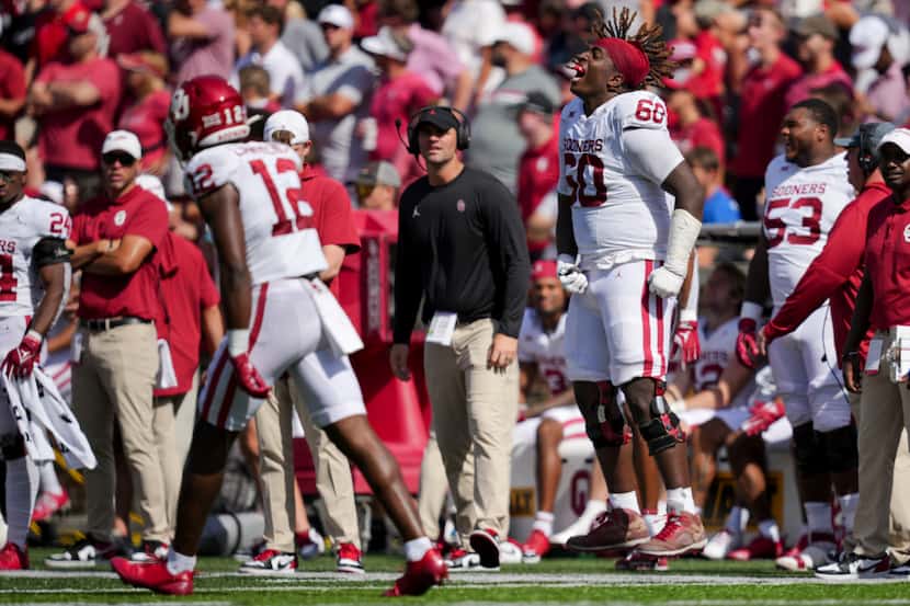 Oklahoma offensive lineman Tyler Guyton yells on the sideline as he reacts to a play during...