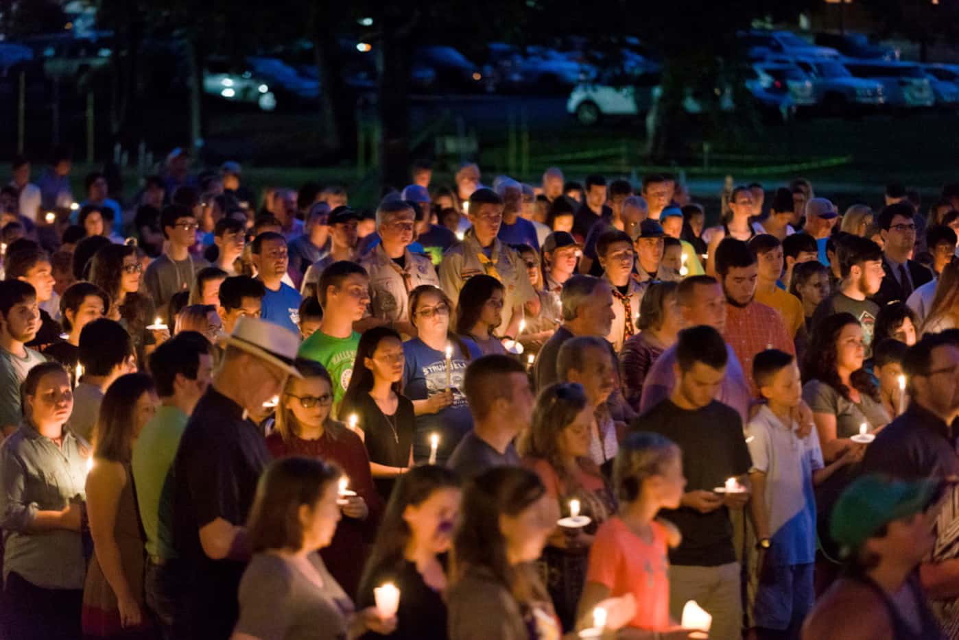 Hundreds from Hallsville, Texas, and surrounding communities gather for a candlelight vigil...