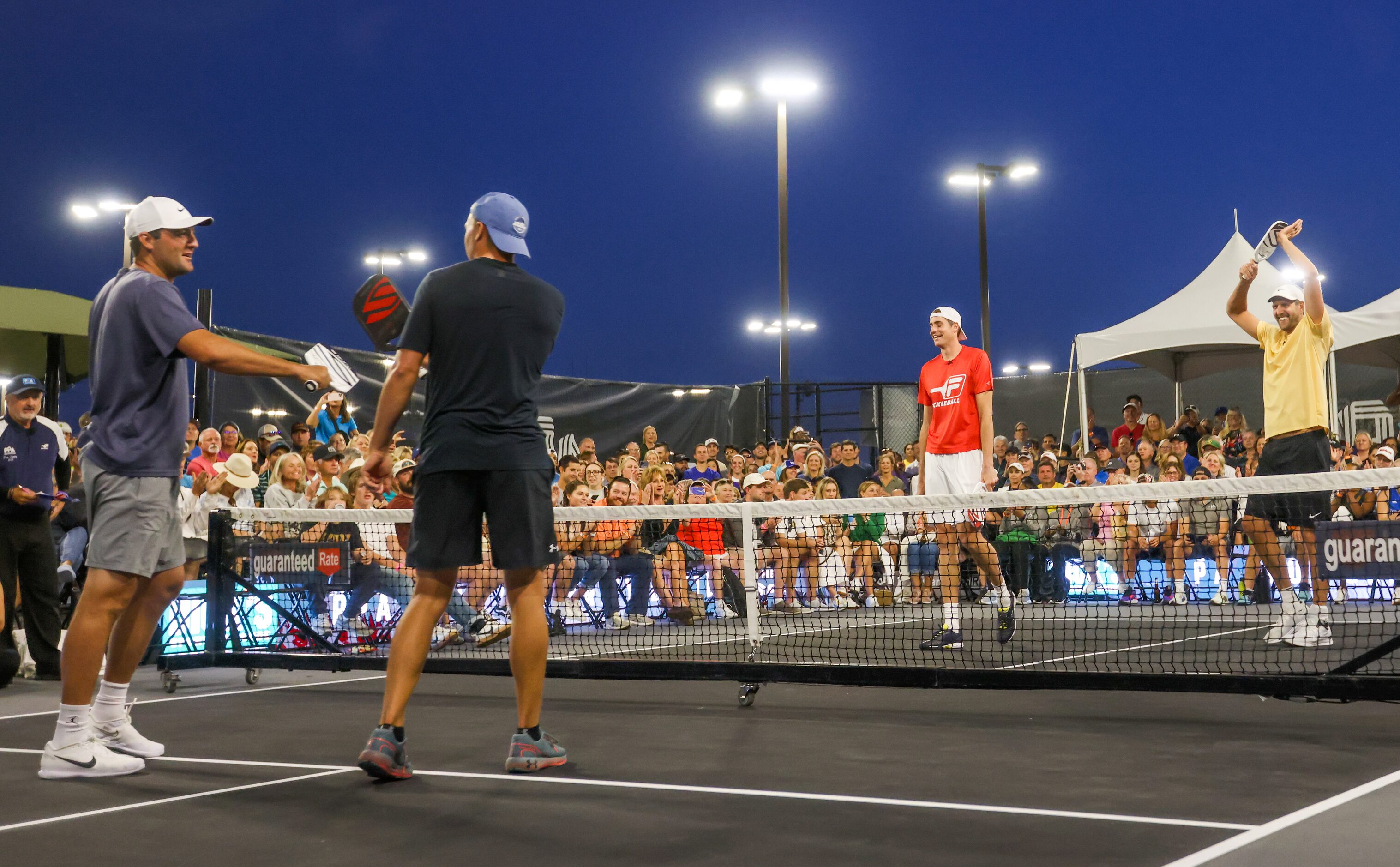 Scottie Scheffler (left to right), Jordan Spieth, John Isner and Dirk Nowitzki finish a...