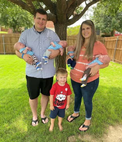 Katie and Chris Sturm with their quadruplets and 3-year-old son, Ryan.
