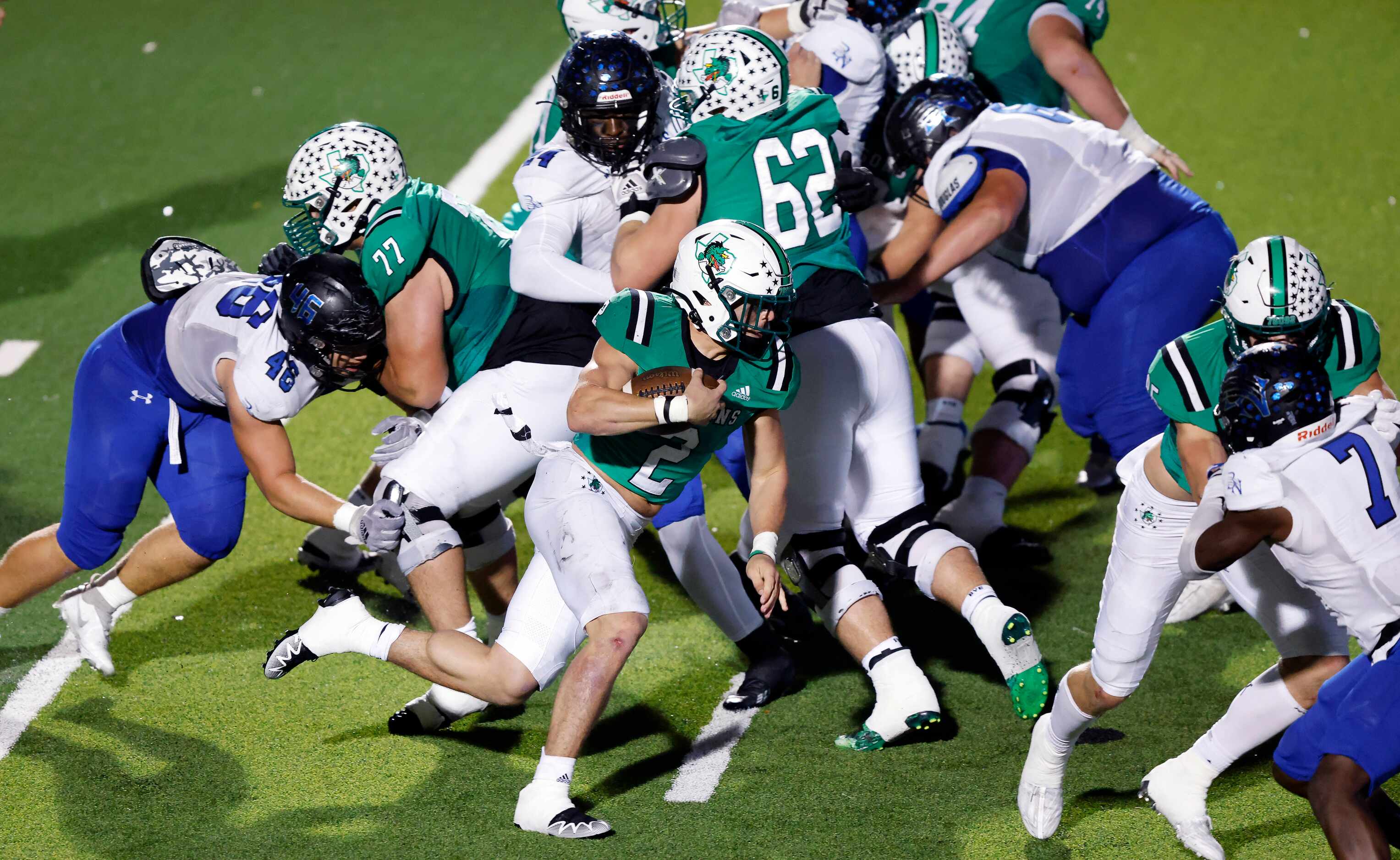 Southlake Carroll Owen Allen (2) turns the corner around th  Byron Nelson defense for a...