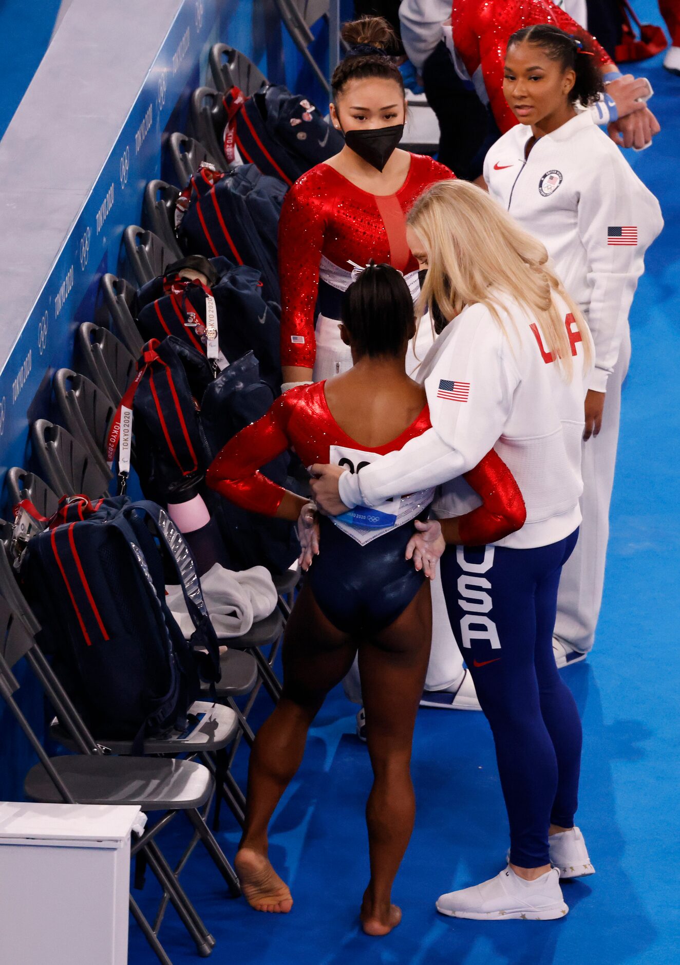 USA’s  Simone Biles gets a hug from her coach Cecile Landi after competing on the vault...