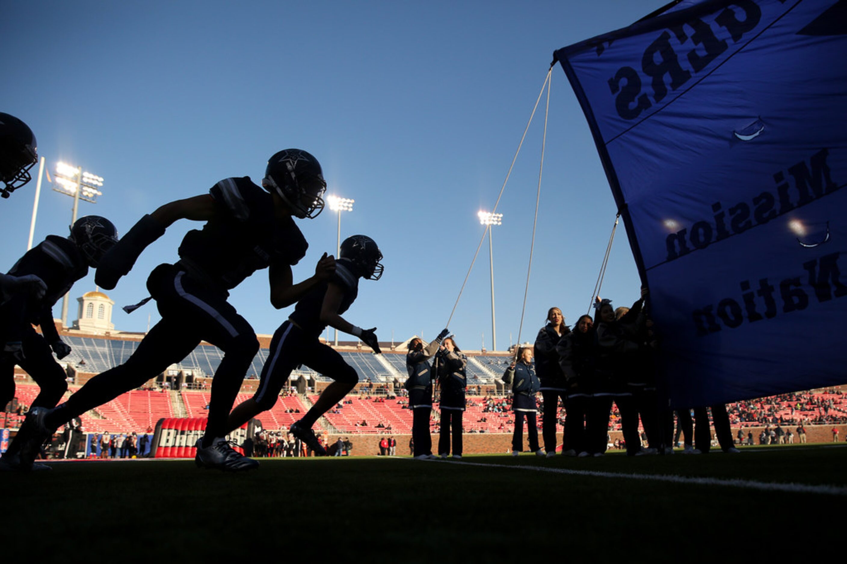 Frisco Lone Star players enter the field for the second half during the Class 5A Division II...