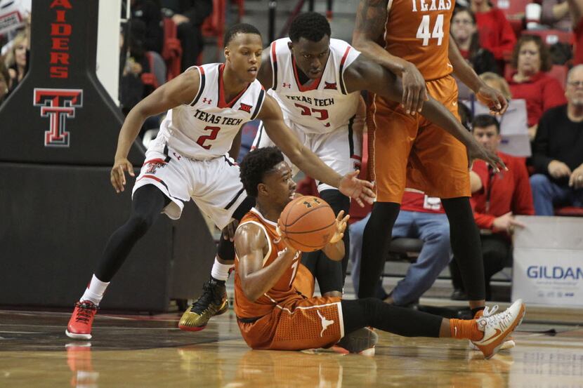 Texas Longhorns guard Isaiah Taylor (1) passes the ball in front of Texas Tech Red Raiders...