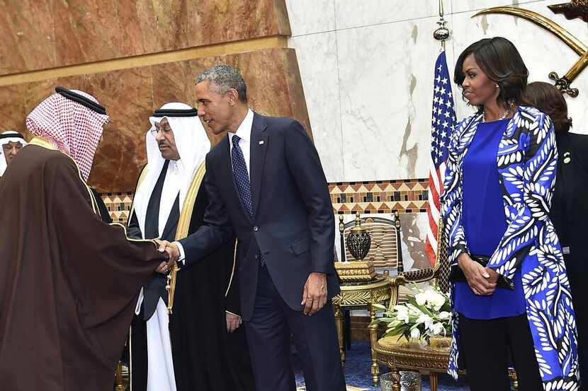 In this photo provided by the Saudi Press Agency, President Barack Obama and first lady...