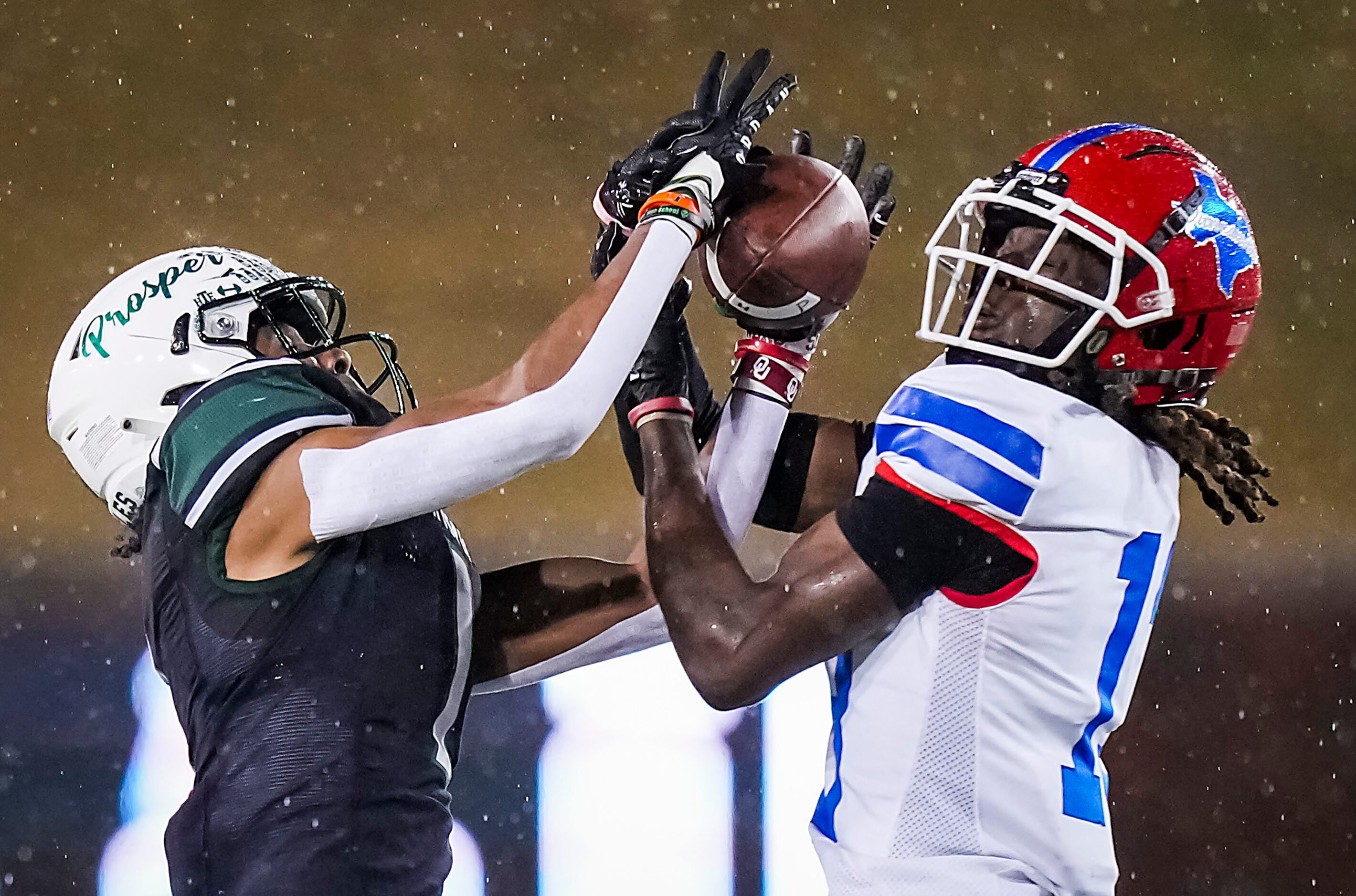 Duncanville defensive back Del'Drick Madison (13) breaks up a pass intended for Prosper wide...