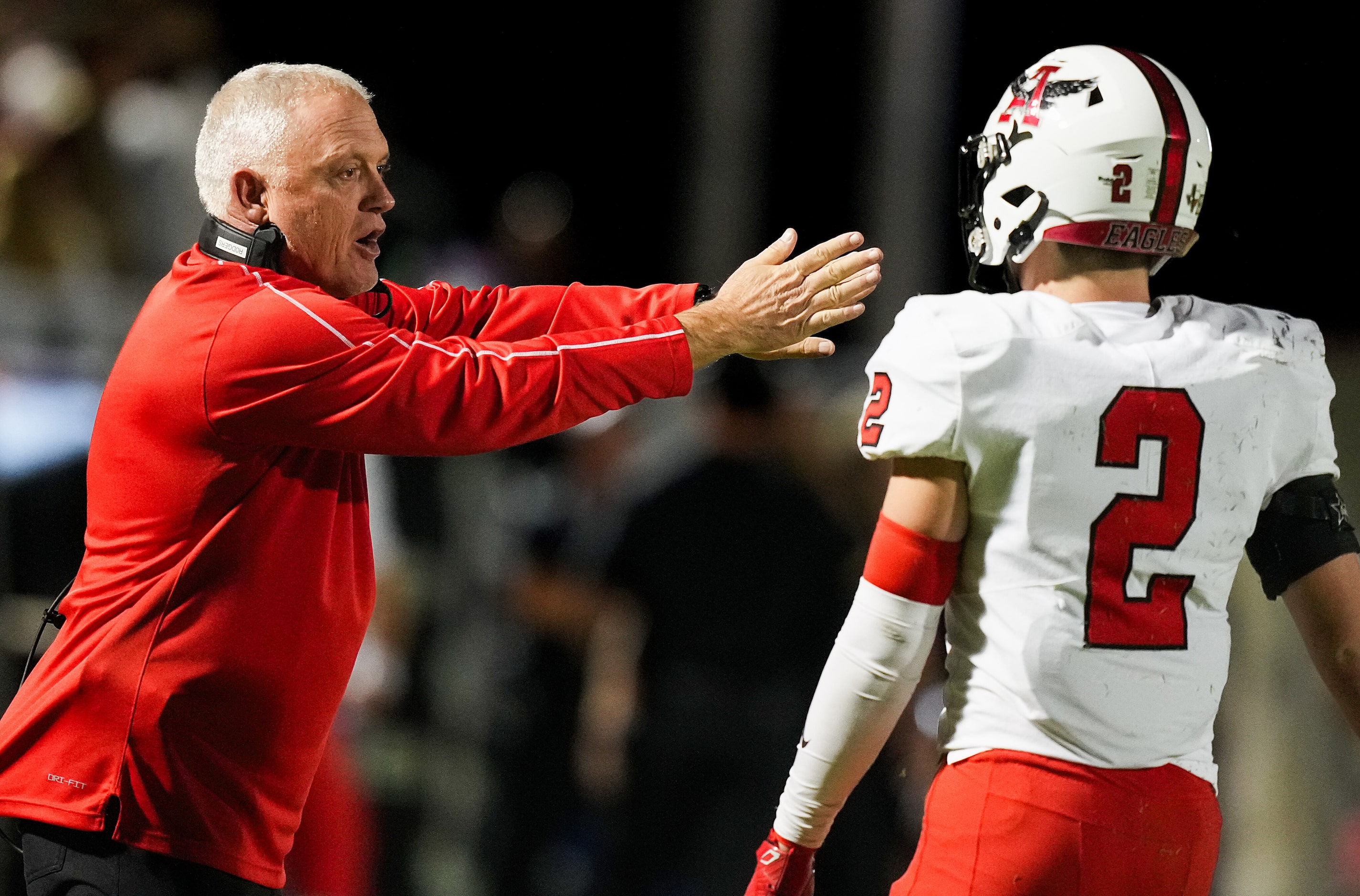 Argyle head coach Todd Rodgers directs defensive back Garrett Westrom (2) during the first...