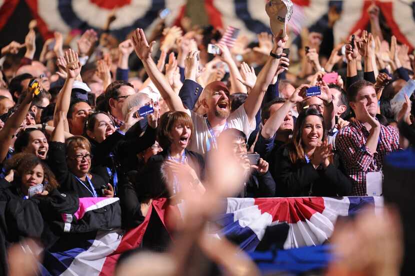 Supporters of US President Barack Obama celebrate as CNN projects victory for Obama on...