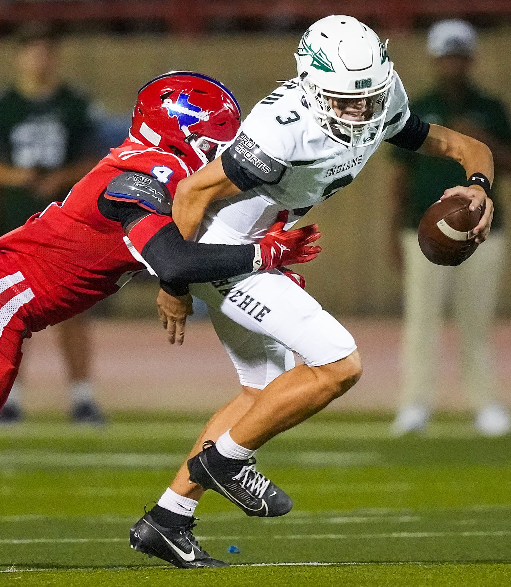 Waxahachie quarterback Jerry Meyer III (3) is sacked by Duncanville linebacker Nehemiah...