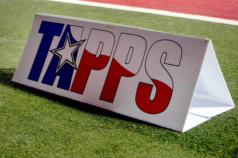 A sideline sign with the TAPPS logo is located on the field during second half action of the...