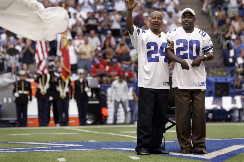 Former Dallas players Everson Walls and Ron Springs acknowledge the cheers of the crowd...