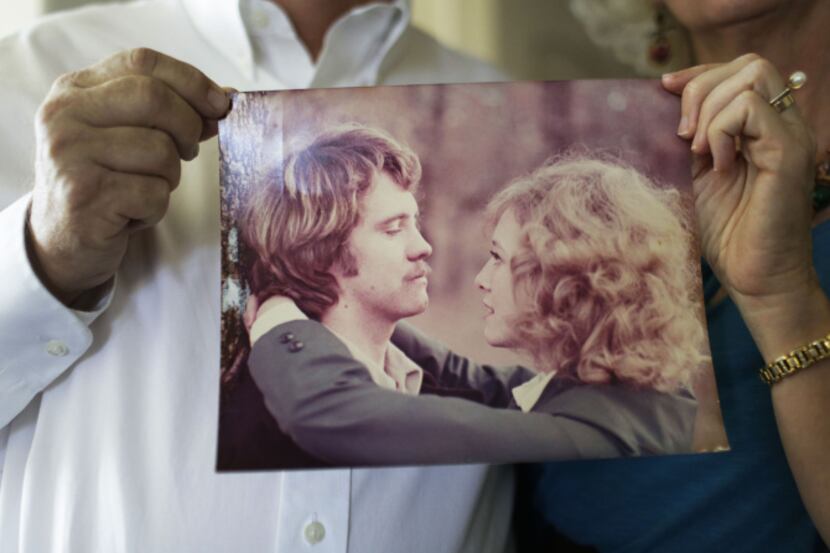 Tom and Cindy Stark hold a photo taken a few months after they started dating when Tom was...