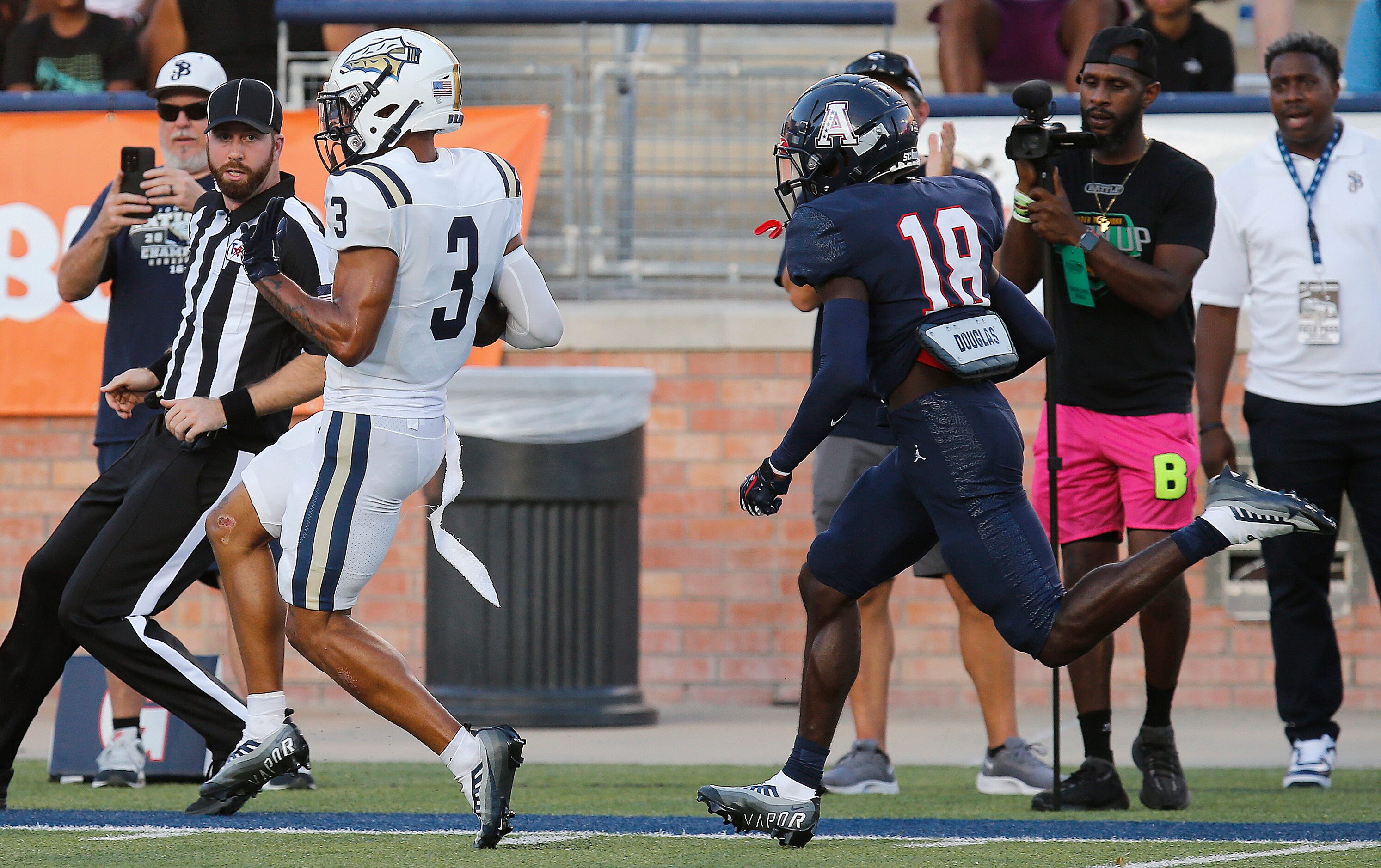 St. John Bosco High School wide receiver DeAndre Moore (3) out runs Allen High School...