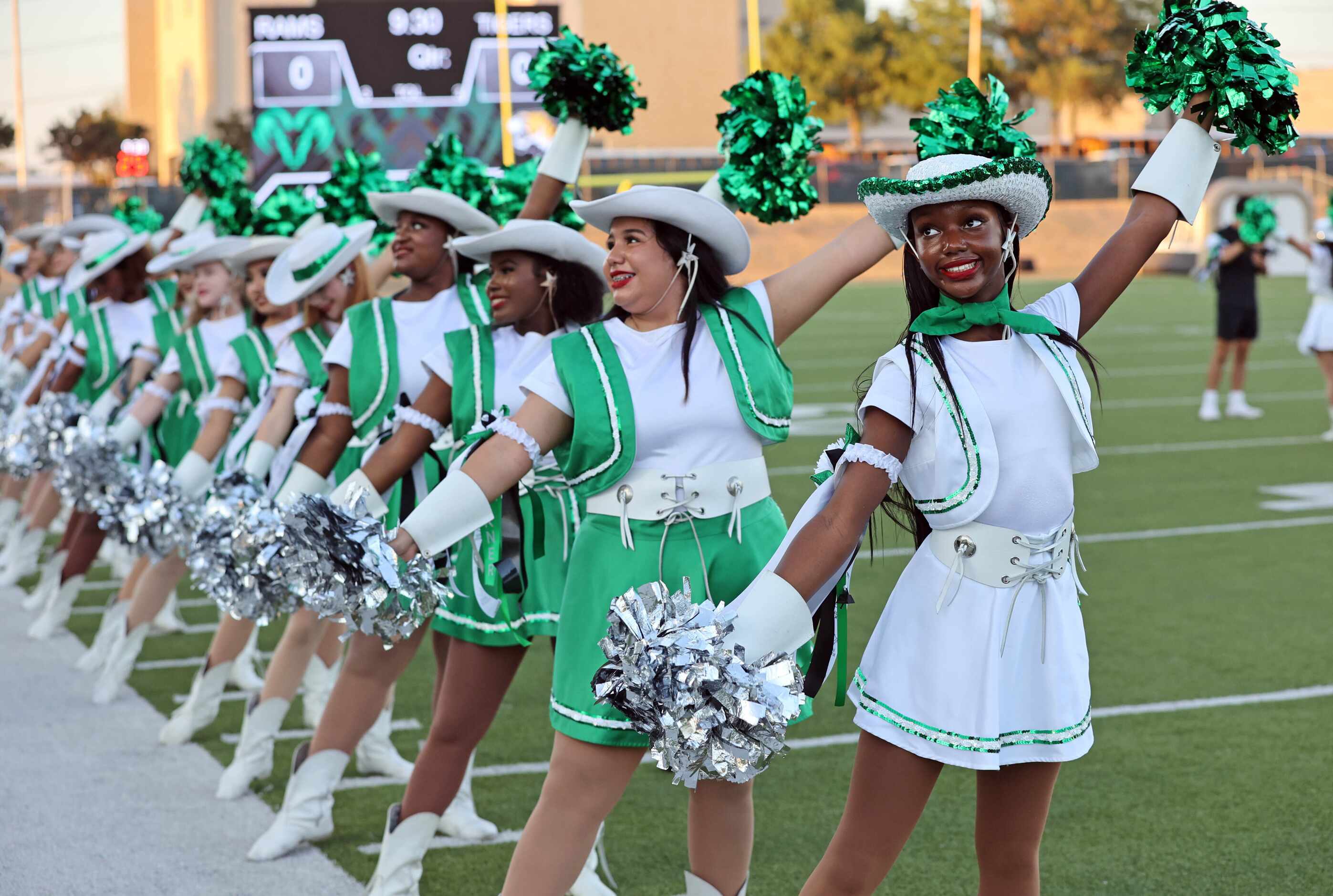 Richardson Berkner high drill teamers help bring the football team onto the field before the...