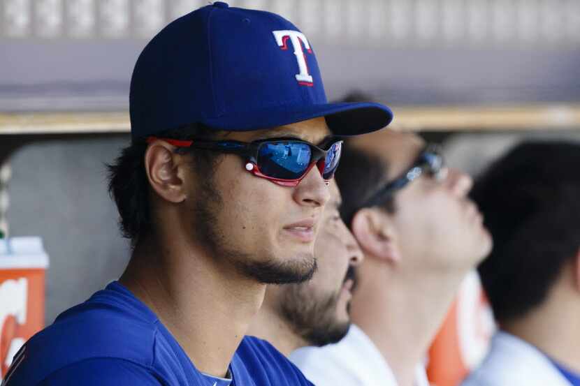 May 25, 2014; Detroit, MI, USA; Texas Rangers starting pitcher Yu Darvish (11) watches from...