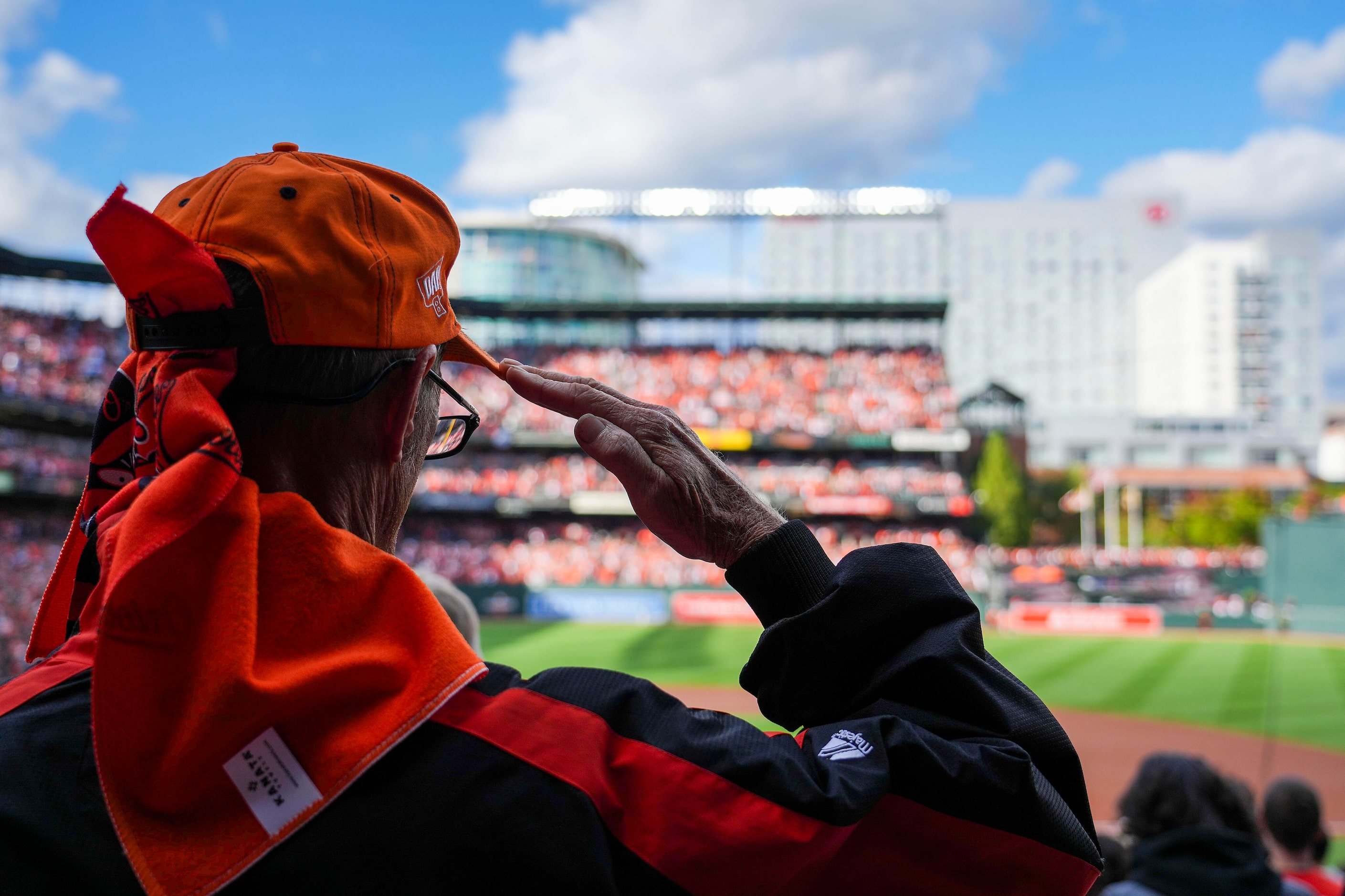 Fans stand for the national anthem before Game 2 of an American League Divisional Series...