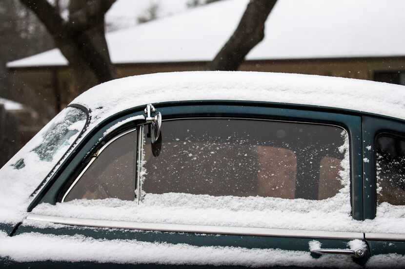 Snow covered a classic car parked in Richardson on Jan. 6, 2017.