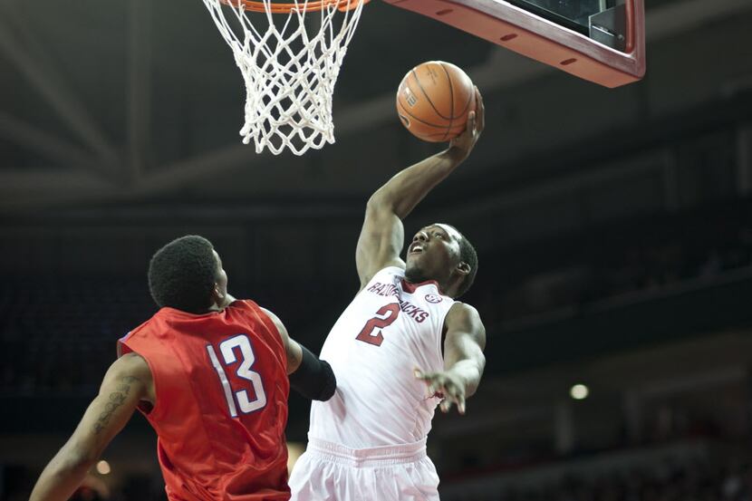 Arkansas' Alandise Harris (2) shoots a basket over SMU's Crandall Head (13) during the first...