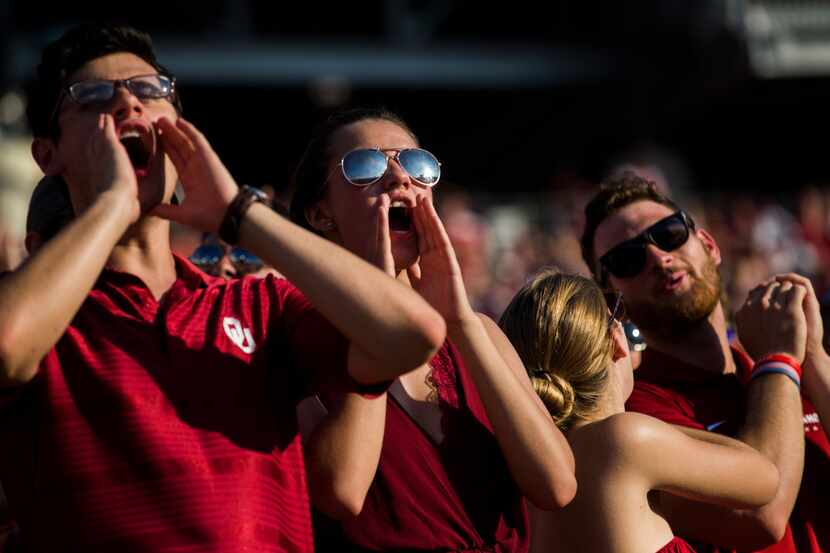 Oklahoma Sooners fans cheer during the third quarter of the AT&T Red River Showdown college...