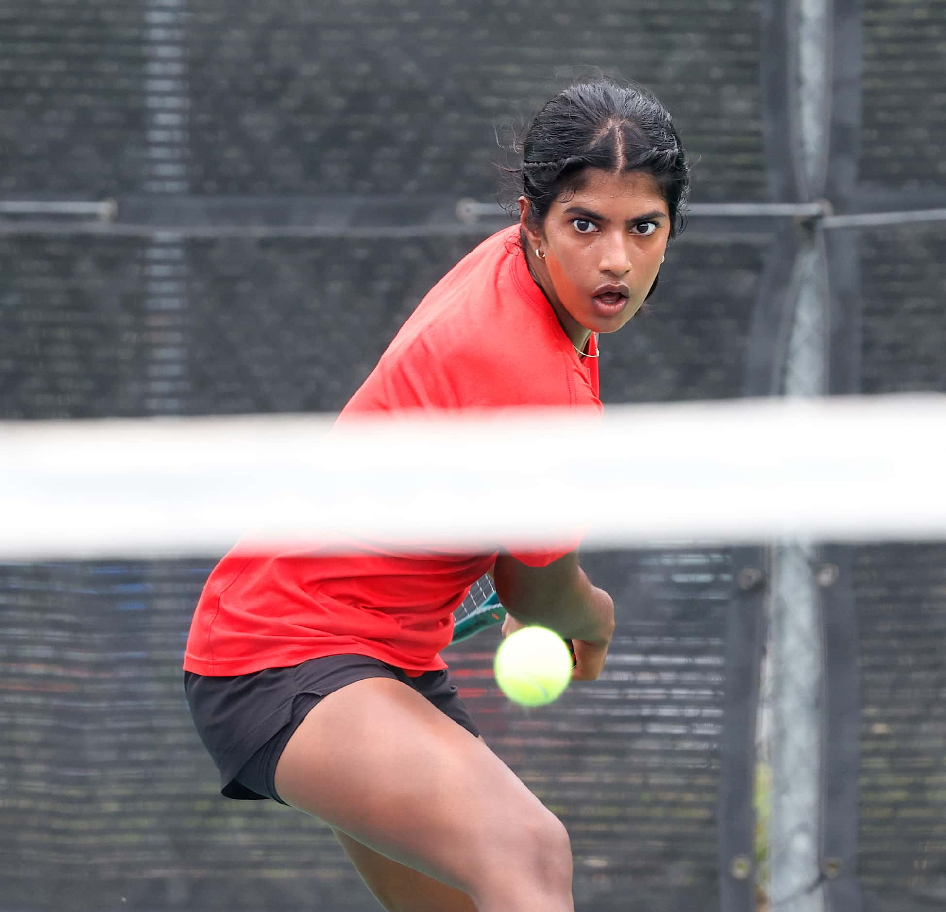 Argyle's Meghna Arun Kumar follows through on a return in a 5A girls singles match where she...