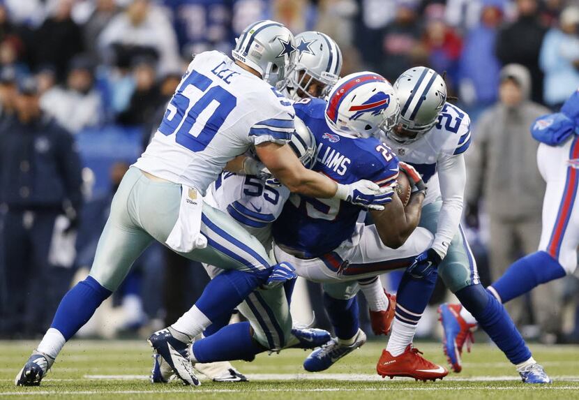 Buffalo Bills running back Karlos Williams (29) is brought down by Dallas Cowboys outside...