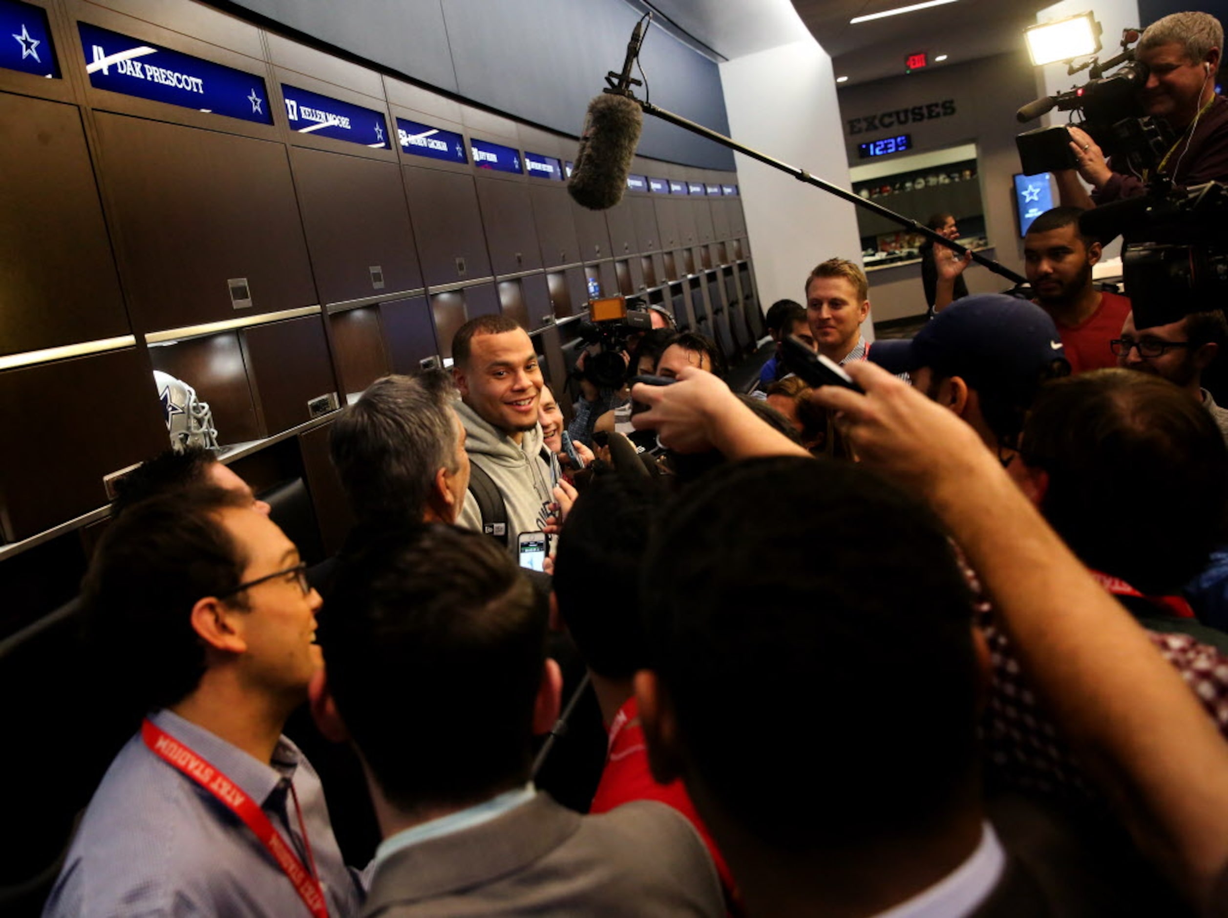 Dallas Cowboys quarterback Dak Prescott talks to the media during locker room clean out at...