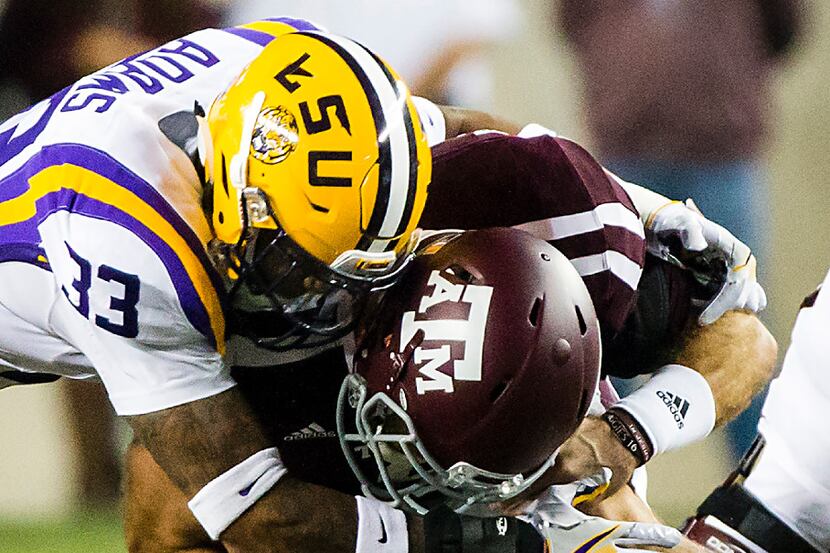 Texas A&M quarterback Trevor Knight (8) is sacked by LSU safety Jamal Adams (33) during the...