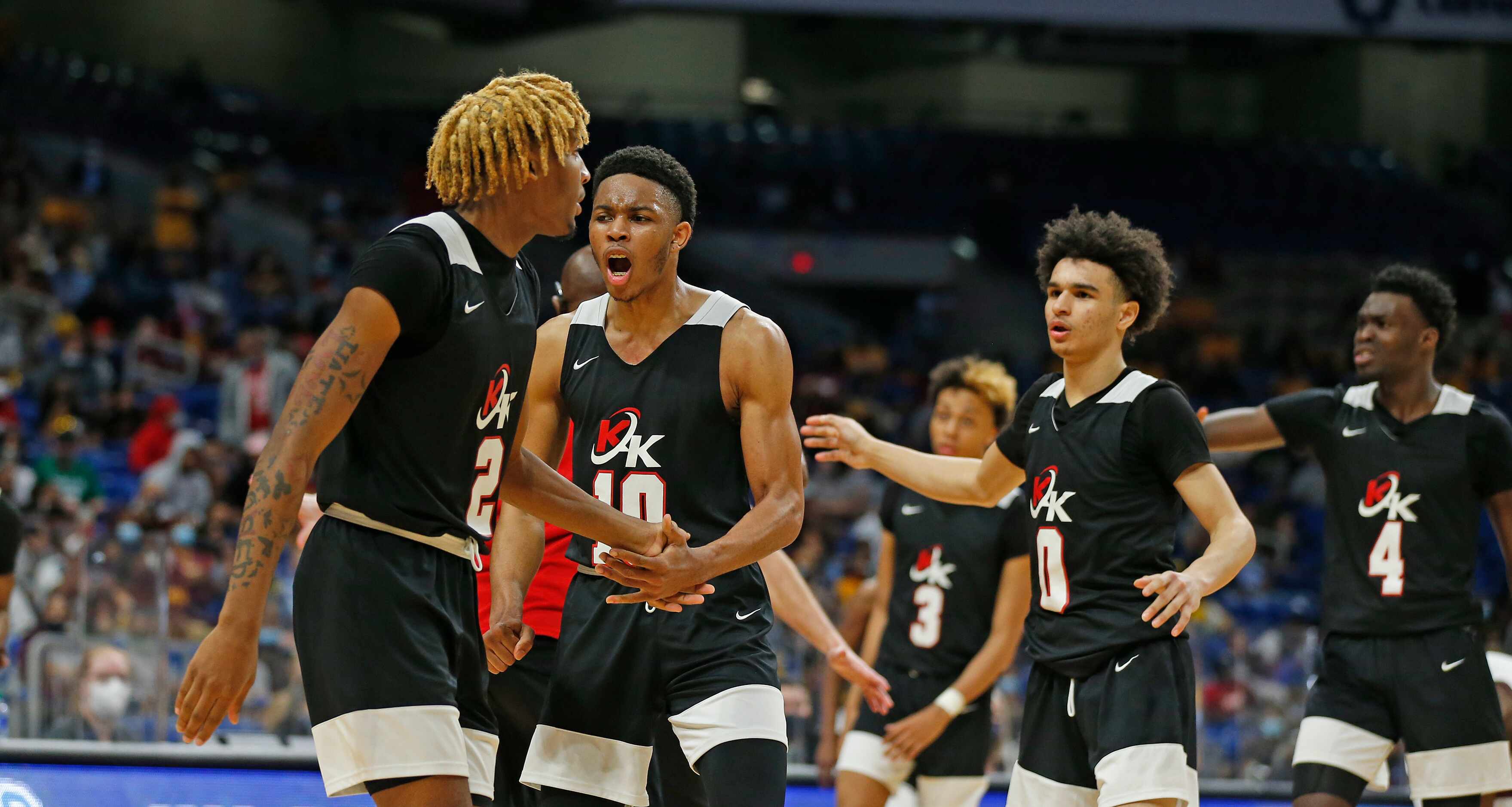 Dallas Kimball Arterio Morris #2 receives congratulations after he hit three UIL boys Class...