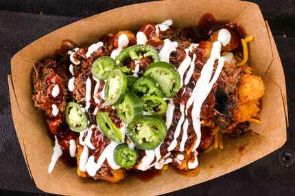 Loaded Tots come studded with brisket, cheese, jalapeños, barbecue sauce and sour cream at...