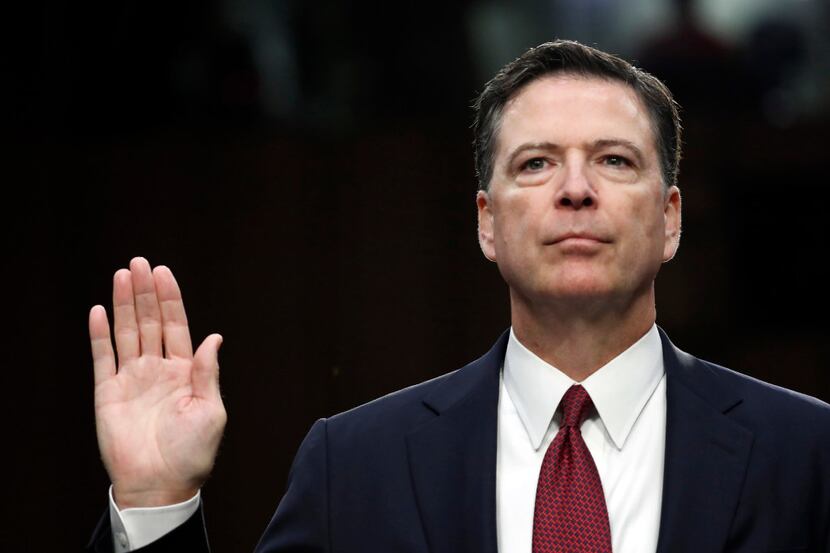 Former FBI director James Comey is sworn in during a Senate Intelligence Committee hearing...